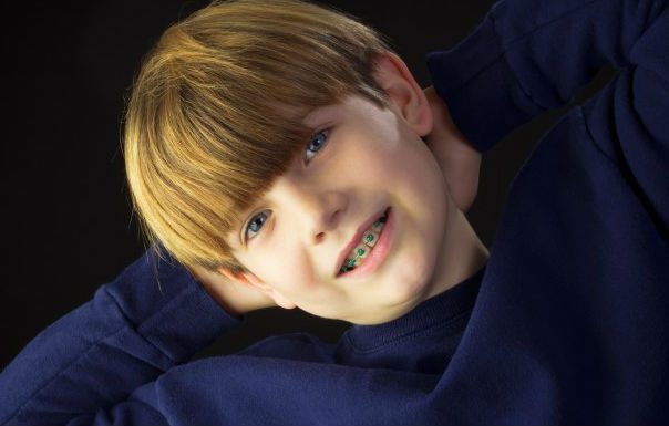young boy smiling with braces