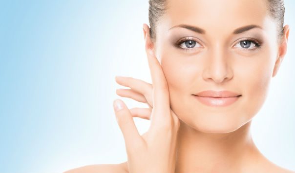 woman wearing makeup and smirking