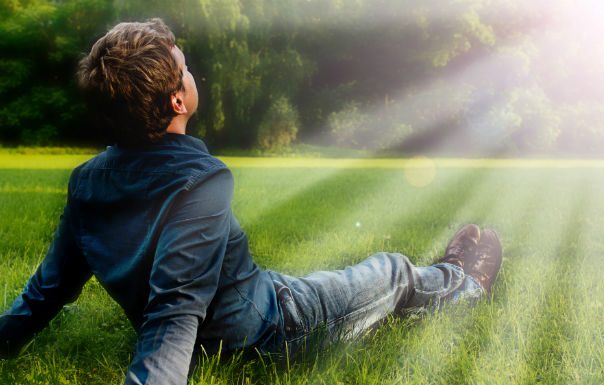 man sitting in grass