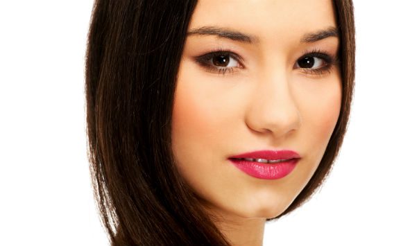 woman with long dark hair wearing eyeliner