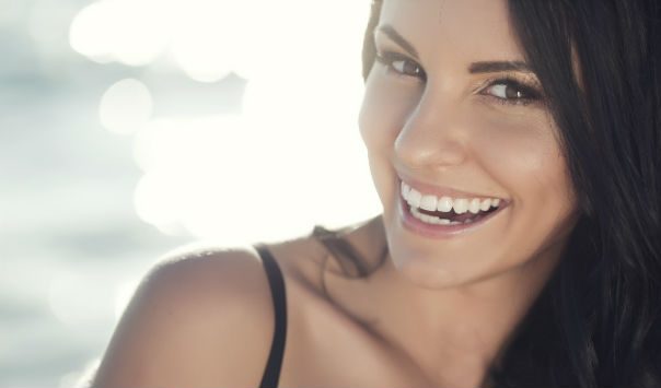 woman with long dark hair smiling