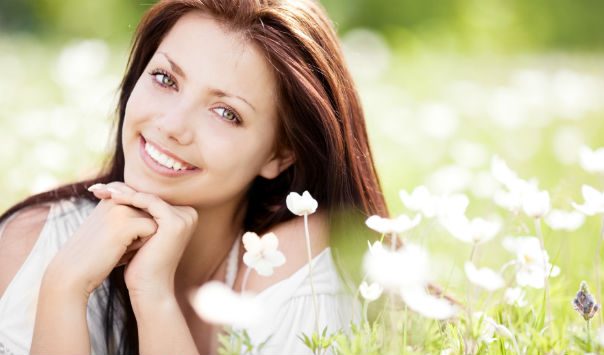 woman in a field of white flowers