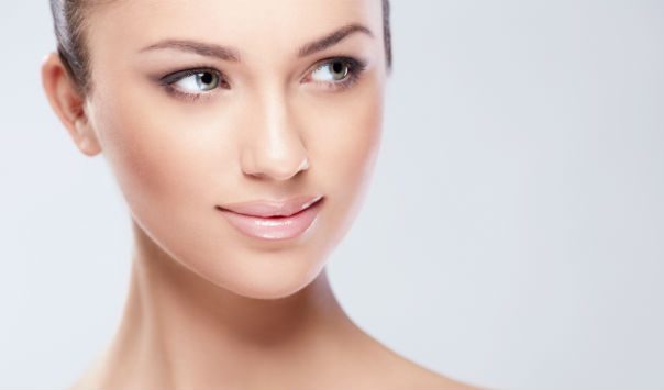 woman wearing makeup looking to the side